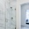 Glass-enclosed shower inside luxury Philadelphia apartment